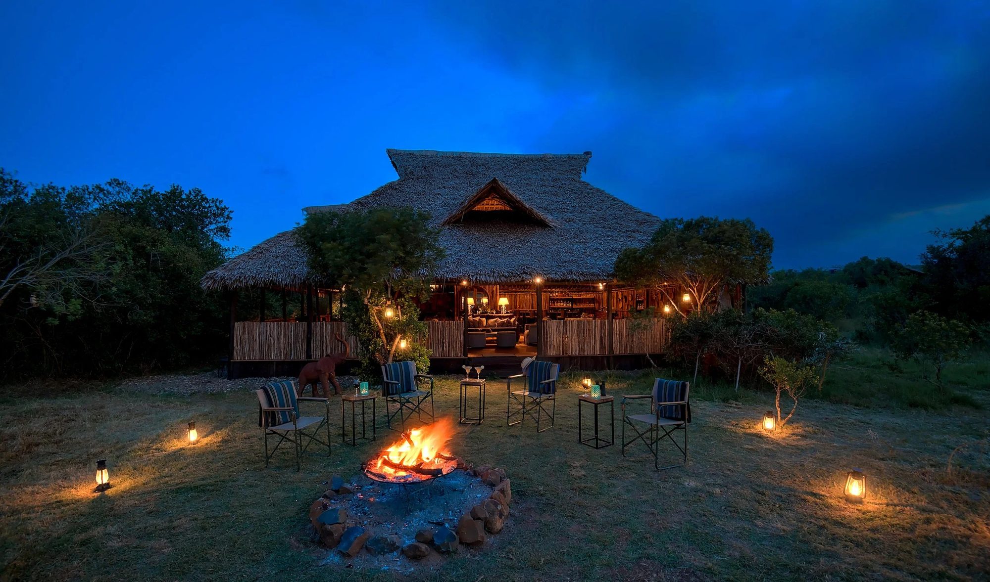 Amazing Laikipia Camp at Ol Maisor at dusk, a fire lit beneath the thatched mess
