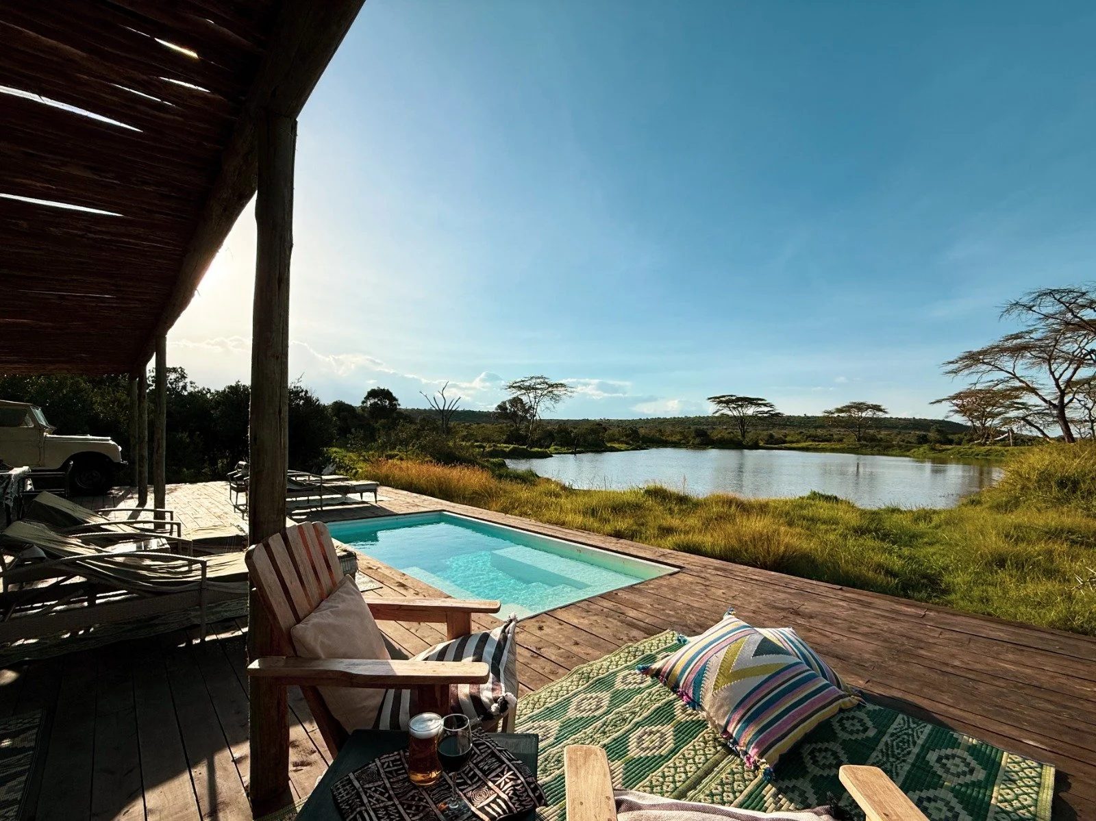 The pool deck at Amazing Laikipia Camp looking over the wildlife dam